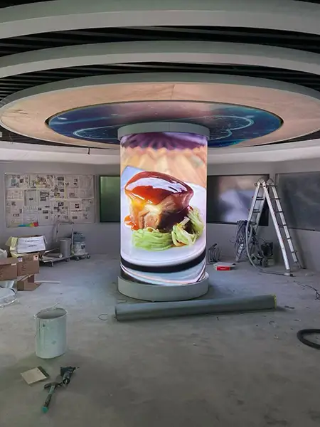 P4 flexible LED display installed on a 360 degree video column in a commercial building.webp