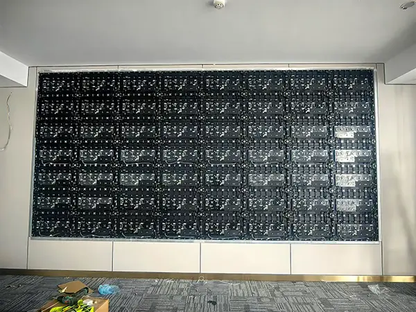 Indoor recessed P1.86 LED video wall installation and steel mounting structure setup.webp