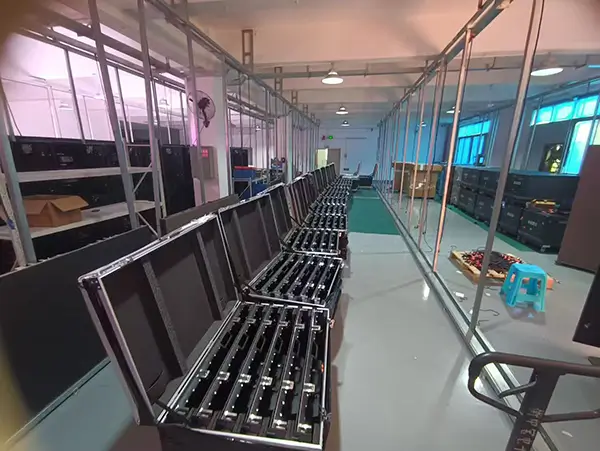 Indoor LED display panels packed in flight cases inside the factory.webp