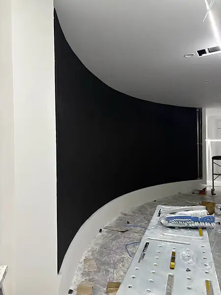 Seamless P4 flexible LED display screen fitted on concave curved wall.webp
