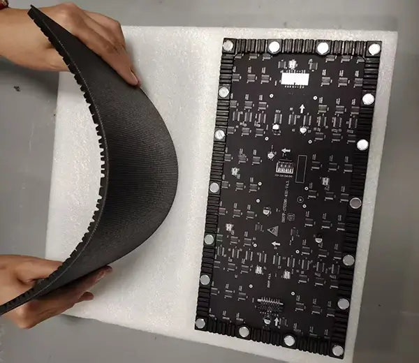 Flexible LED display module bending test showing soft PCB flexibility and magnetic back structure.webp