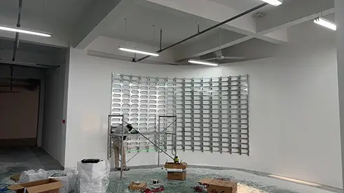 Curved steel frame and cable routing for flexible LED display installation.webp